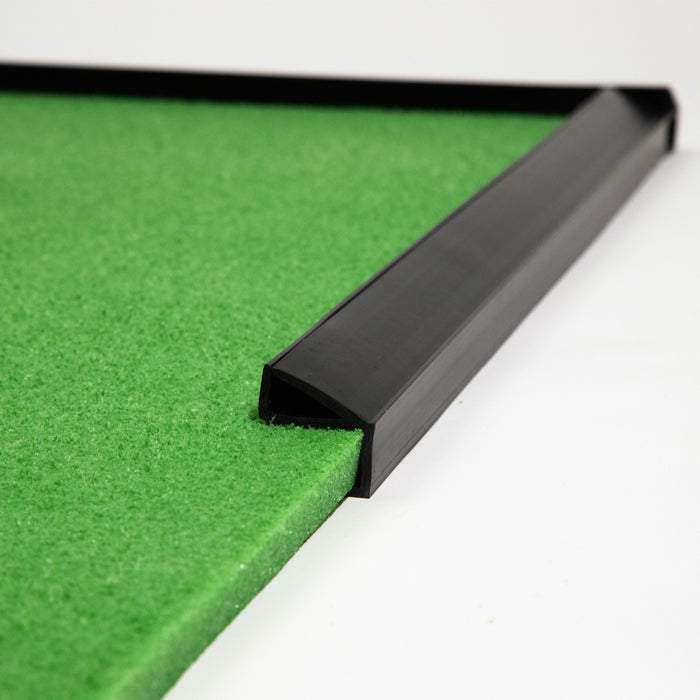 Close-up of a green BirdieBall Putting Green corner with heavy BirdieBall Bumpers (Set of 2, various sizes) as golf ball stops, shown against a white background.