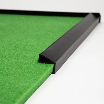 Close-up of a green BirdieBall Putting Green corner with heavy BirdieBall Bumpers (Set of 2, various sizes) as golf ball stops, shown against a white background.