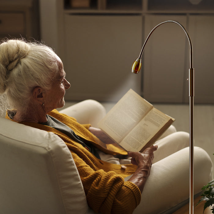 Woman using the FOCUS Adjustable Beam Floor Lamp
