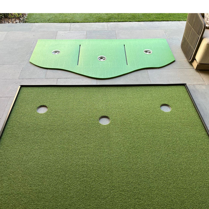 A BirdieBall Full Width Hole Deepening/Break Shim (for use with turf mats) lies disassembled on a stone patio, featuring Tour Grade Turf, a detached curved top piece, and three visible holes.