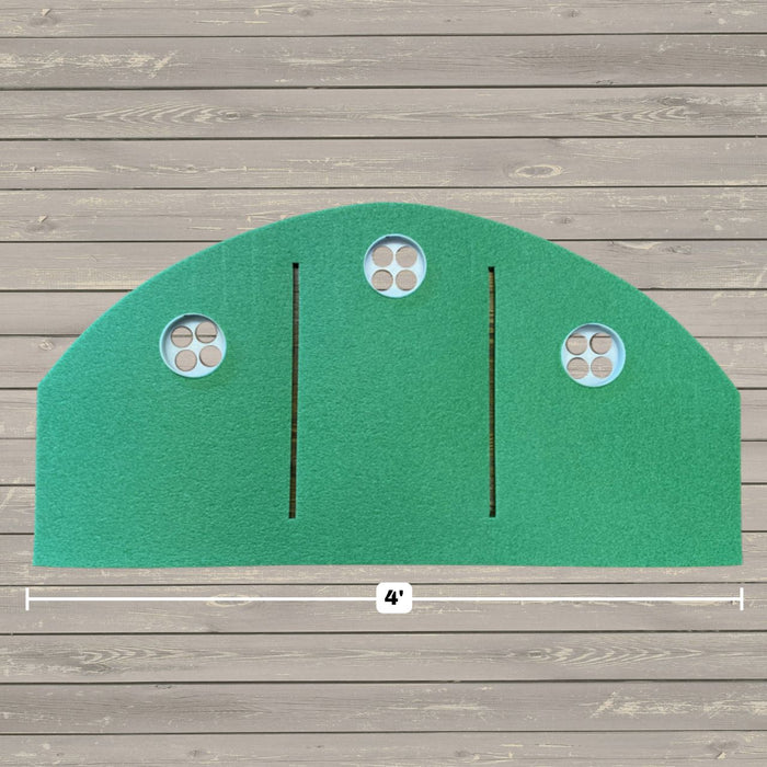 The BirdieBall Full Width Hole Deepening/Break Shim (for use with turf mats) is shown installed on a green semicircular putting surface with three golf holes, two black lines, and a 4-foot mark on the wooden floor below.