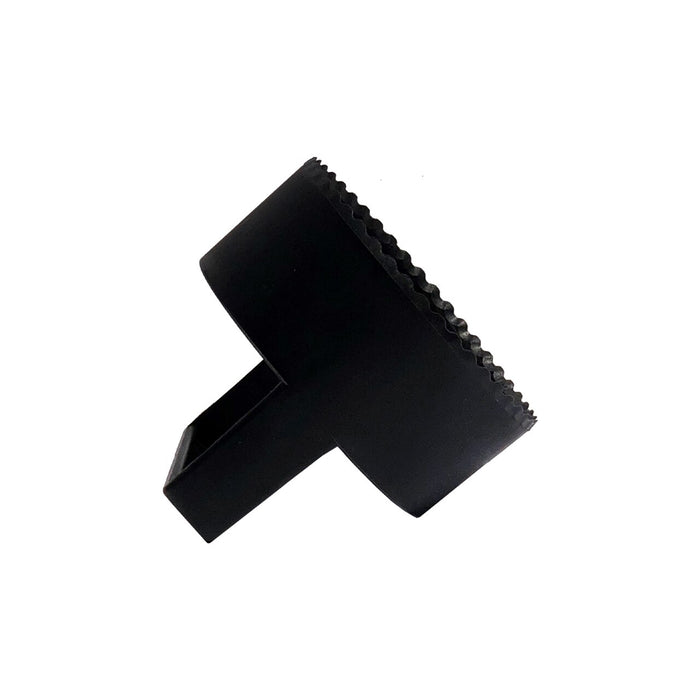 The BirdieBall Golf Hole Cutter is a black plastic tool with a cylindrical body, serrated edge, and rectangular handle, displayed on a white background.