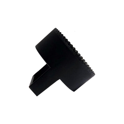 The BirdieBall Golf Hole Cutter is a black plastic tool with a cylindrical body, serrated edge, and rectangular handle, displayed on a white background.