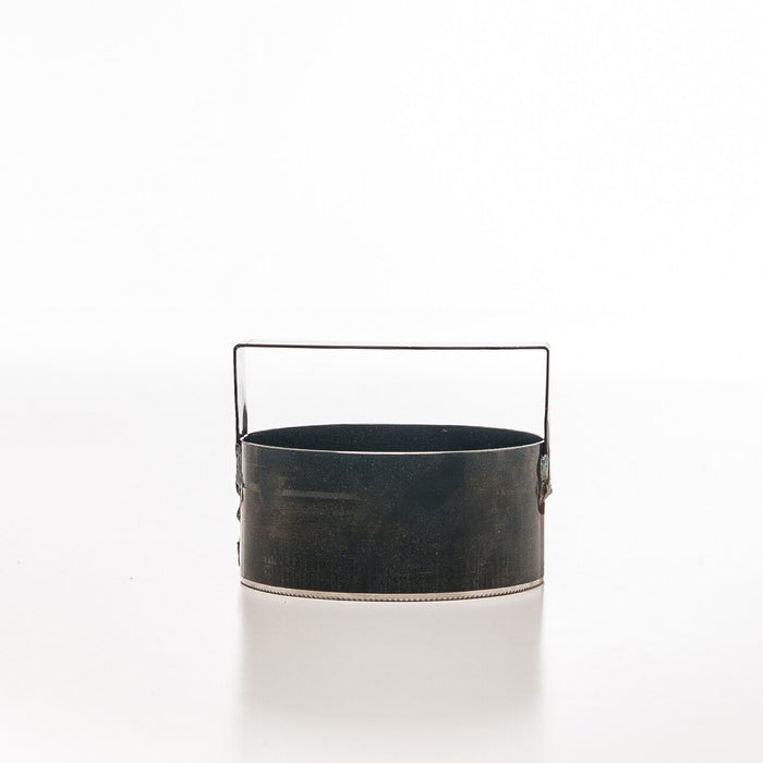 The BirdieBall Golf Hole Cutter is a round, black metal container with a handle, shown on a plain white background.