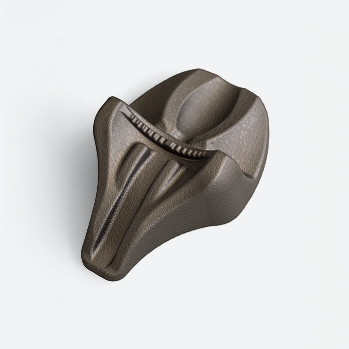 Metallic decompression device with a textured surface on a white background