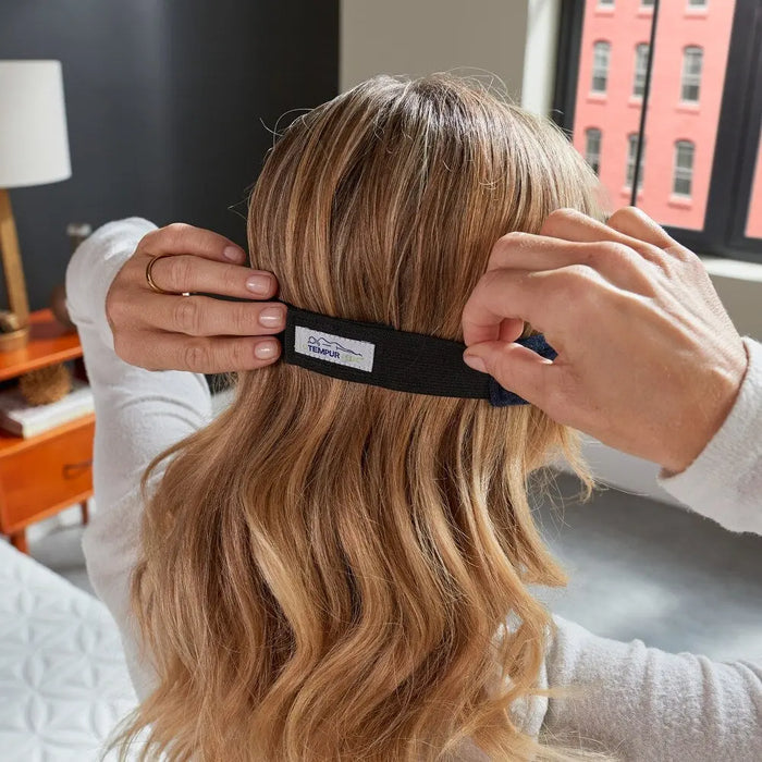 Back view of the adjustable strap on the Tempur Pedic Sleep Mask shown on a woman