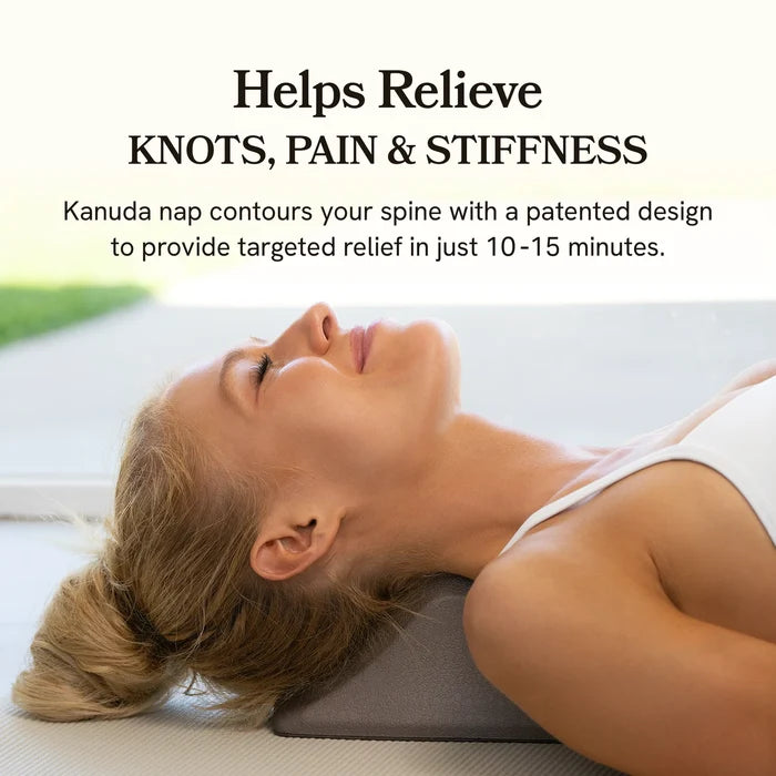 Woman using a Kanuda gray spine decompression stretcher to relieve knots, pain, and stiffness with text on image.
