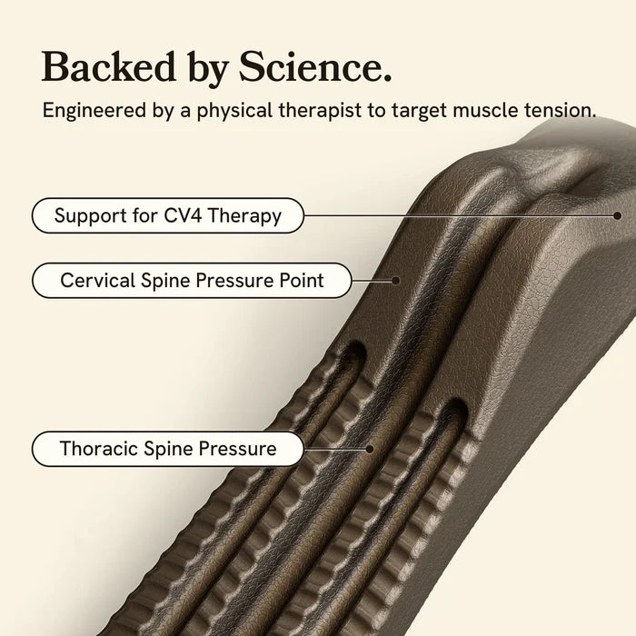 Close-up of a gray spine decompression stretcher with labeled pressure points on a beige background.