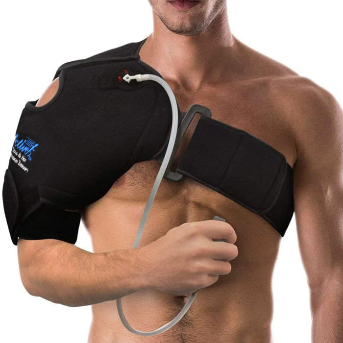 A man wearing a black shoulder and therapy device with a clear tube, shown on a white background.