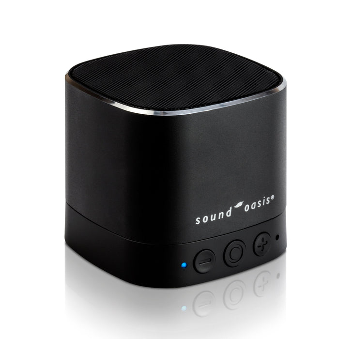 A black portable Bluetooth speaker with a cylindrical shape, featuring the 'sound oasis' logo on the front, set against a clean white background with a soft reflection below.